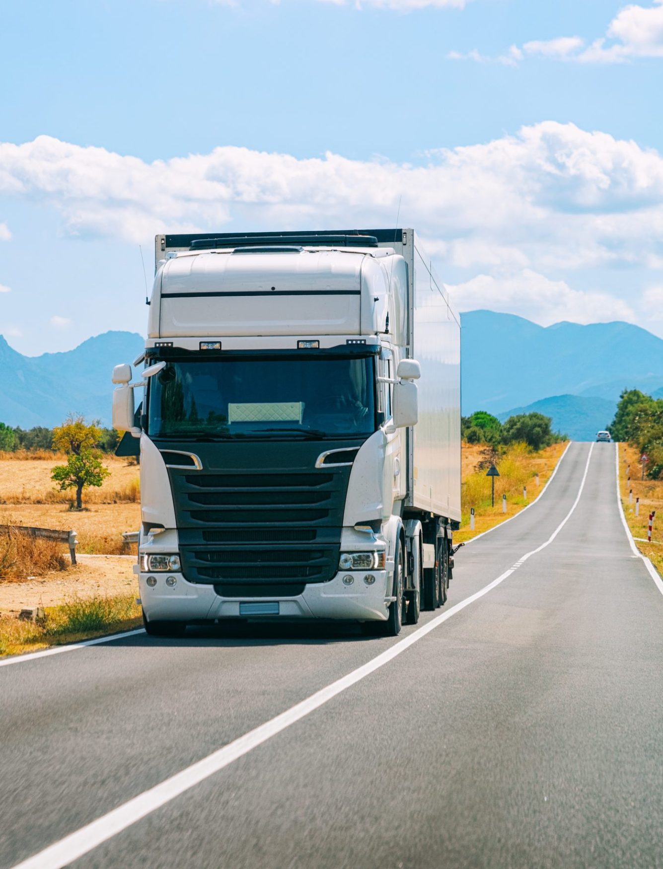 Scenery with Truck in the highway in Carbonia near Cagliari in Sardinia in Italy. Lorry transport delivering some freight cargo.